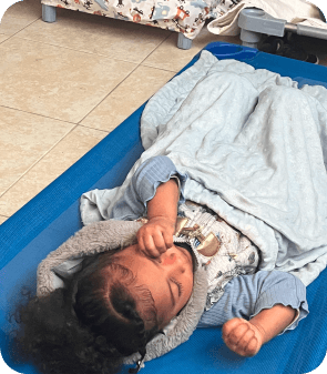 Infant resting during nap time in a nurturing and secure infant child care facility in Las Vegas NV.