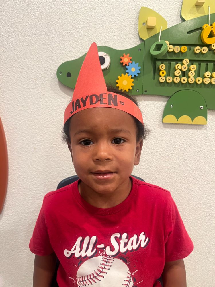 ayden wearing a birthday crown and smiling inside a Christian daycare center classroom in Las Vegas.